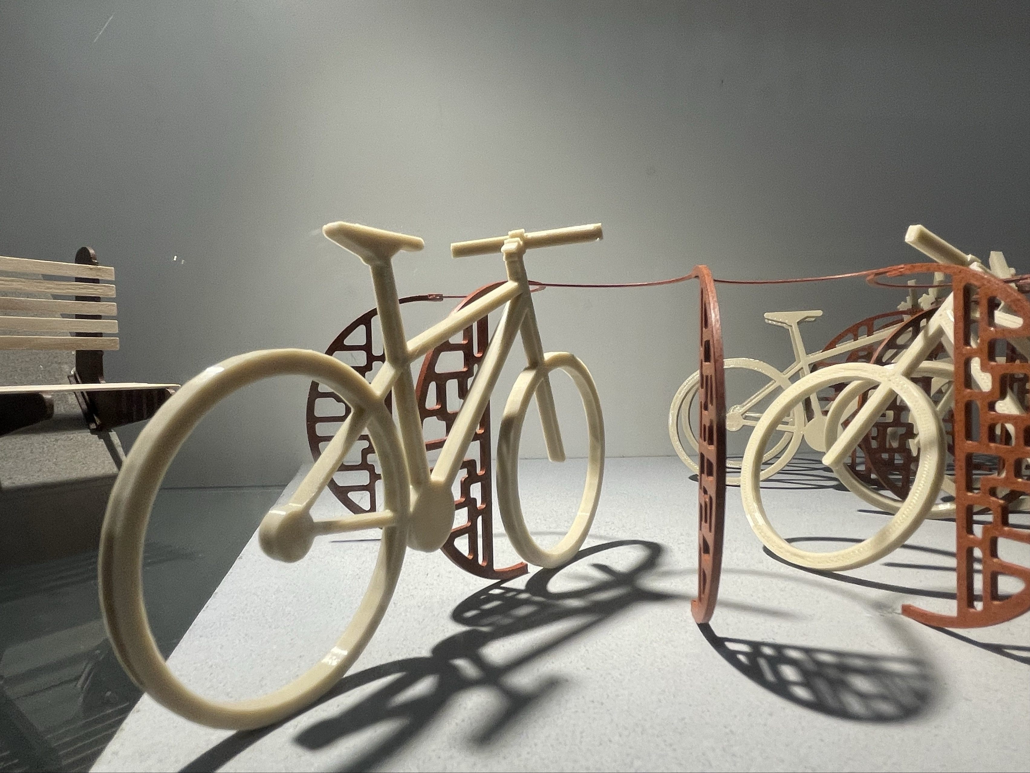 This bicycle was 3D printed using plastic. It was produced and displayed from the furniture Crafts & Design program.