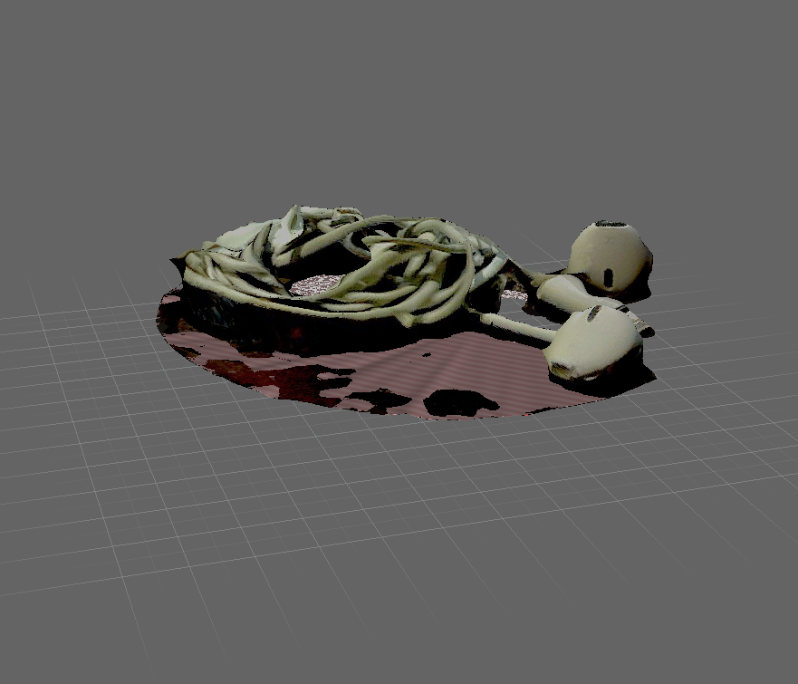 This is my headphone model after I filled the holes. Although it turned out well, I'm considering using a different item to represent music.