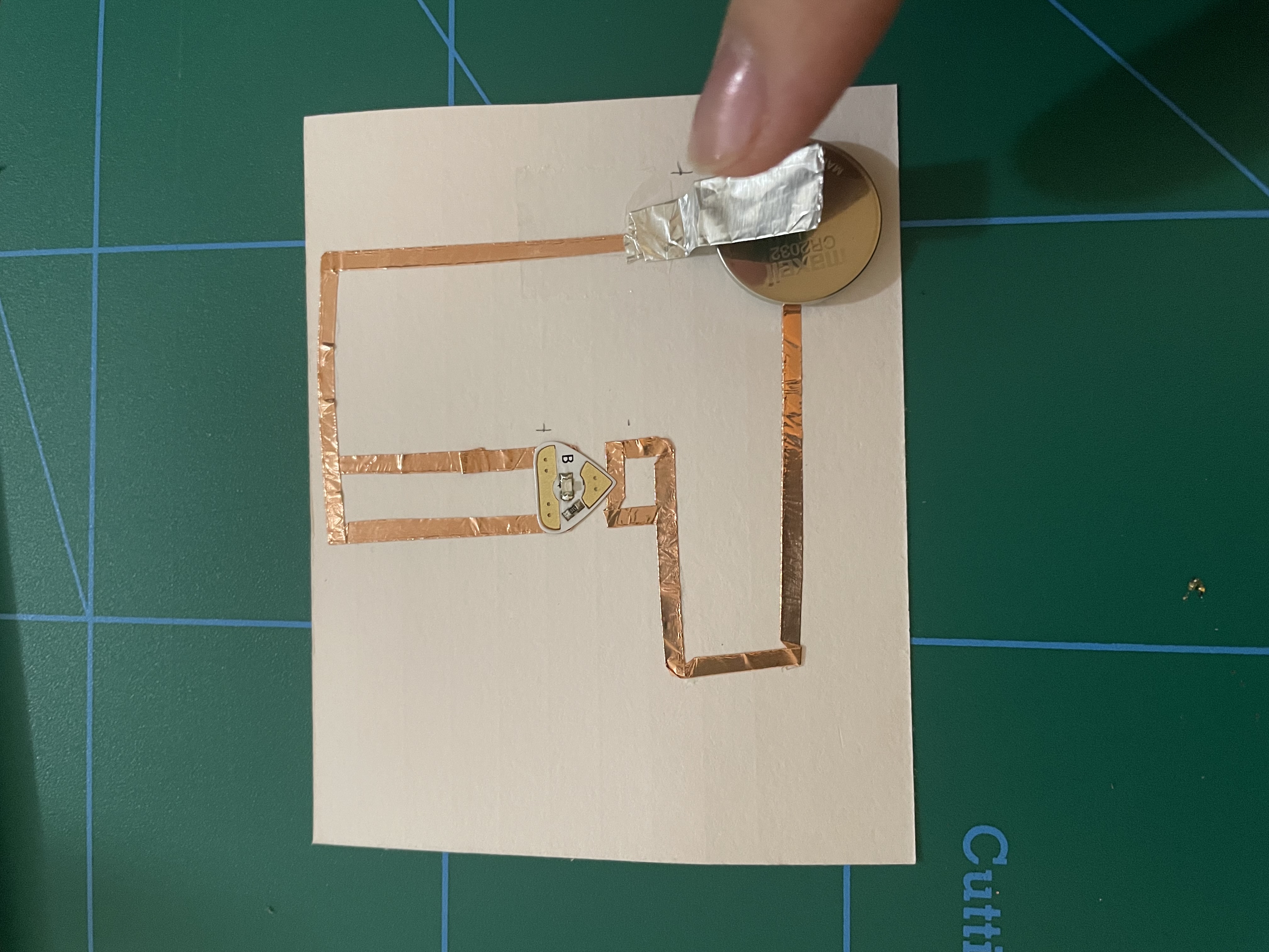 I decided to try a simple circuit but have it be an interesting shape. I used this circuit to practice copper tape folding.
