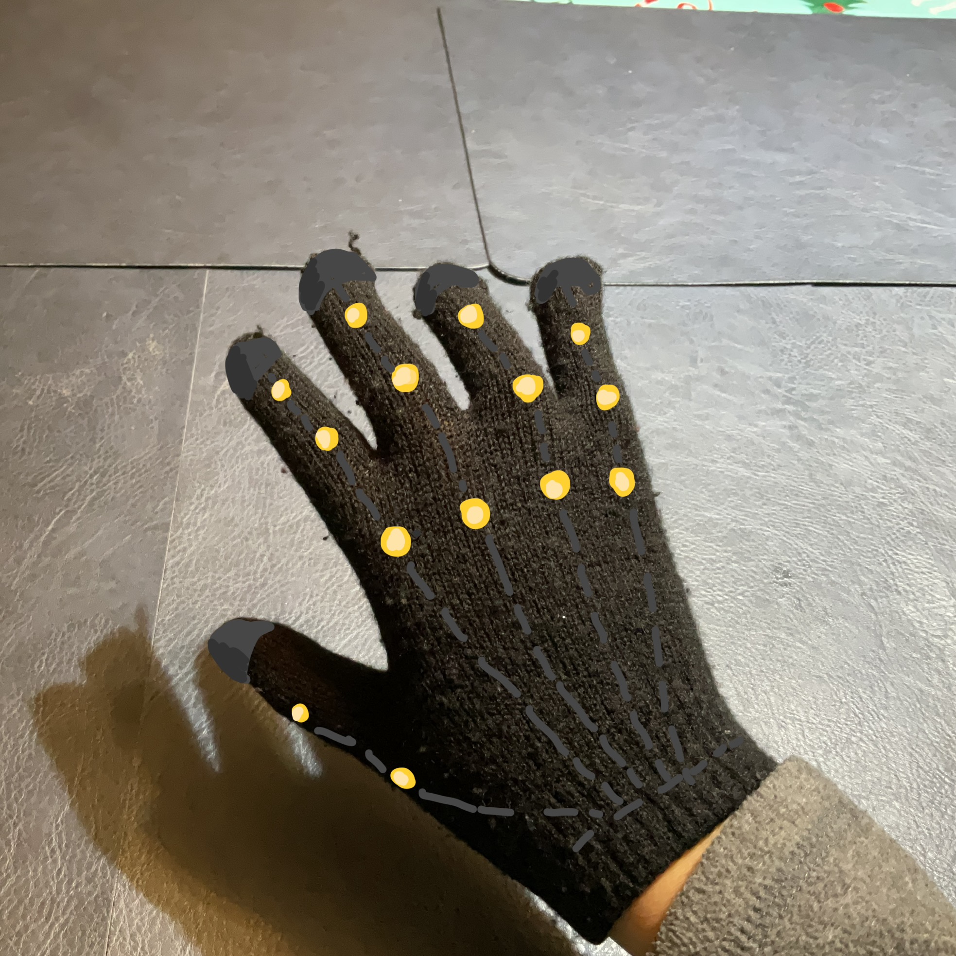 If I were to use the gloves as a point of reference, I would place light on each joint and create a skeleton design for further guidance.