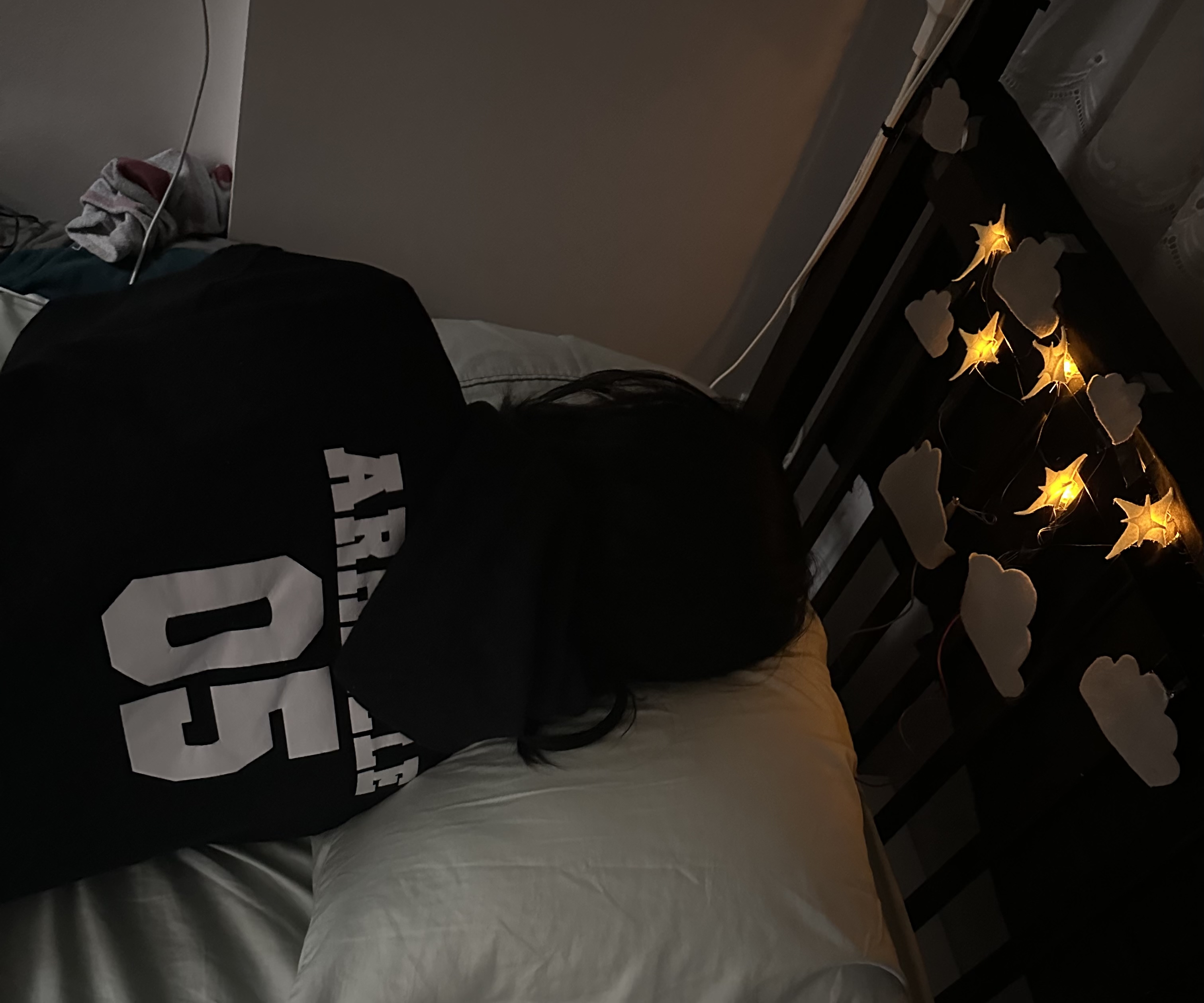 Here is an example of myself on the pillow. Since there's pressure on the pillow, it presses down on the switch, which will light up the LED lights.