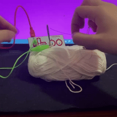 Similar to the last experimentation, I continued using fabrication tools such as a needle and thread to create a connection. I used a conductive thread to connect the needles, which were both connected to the ground and left arrow, when it's threaded through both needles.