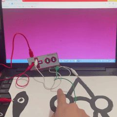 I continued to test the conductive paint with the Makey Makey. Instead of just one sensor, there's two. On the left is a fish painting, while the right ride has a symbol from an anime series, Gachiakuta. Each painting was wired to different sensor, so it triggered different sounds.