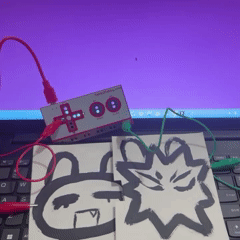 The last conductive painting I tested was a simple illustration of two fictional characters. Since I connected the character on the paper, I decided to cut it and create a switch. When I press down on the space between the characters, it triggers the left arrow sensor.